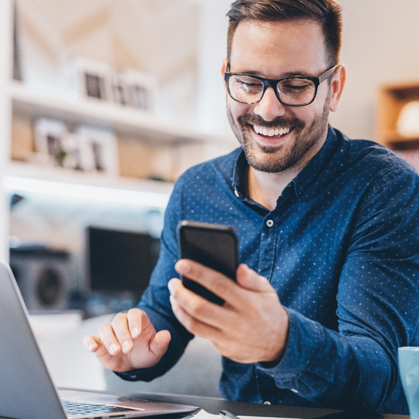 A man using face id to sign into the mobile app.