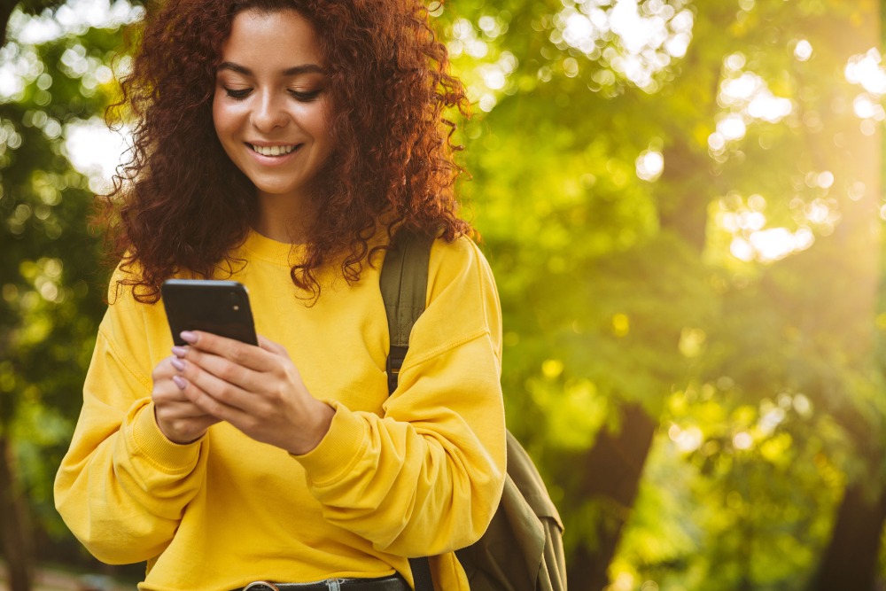 Smiling lady on her cell phone