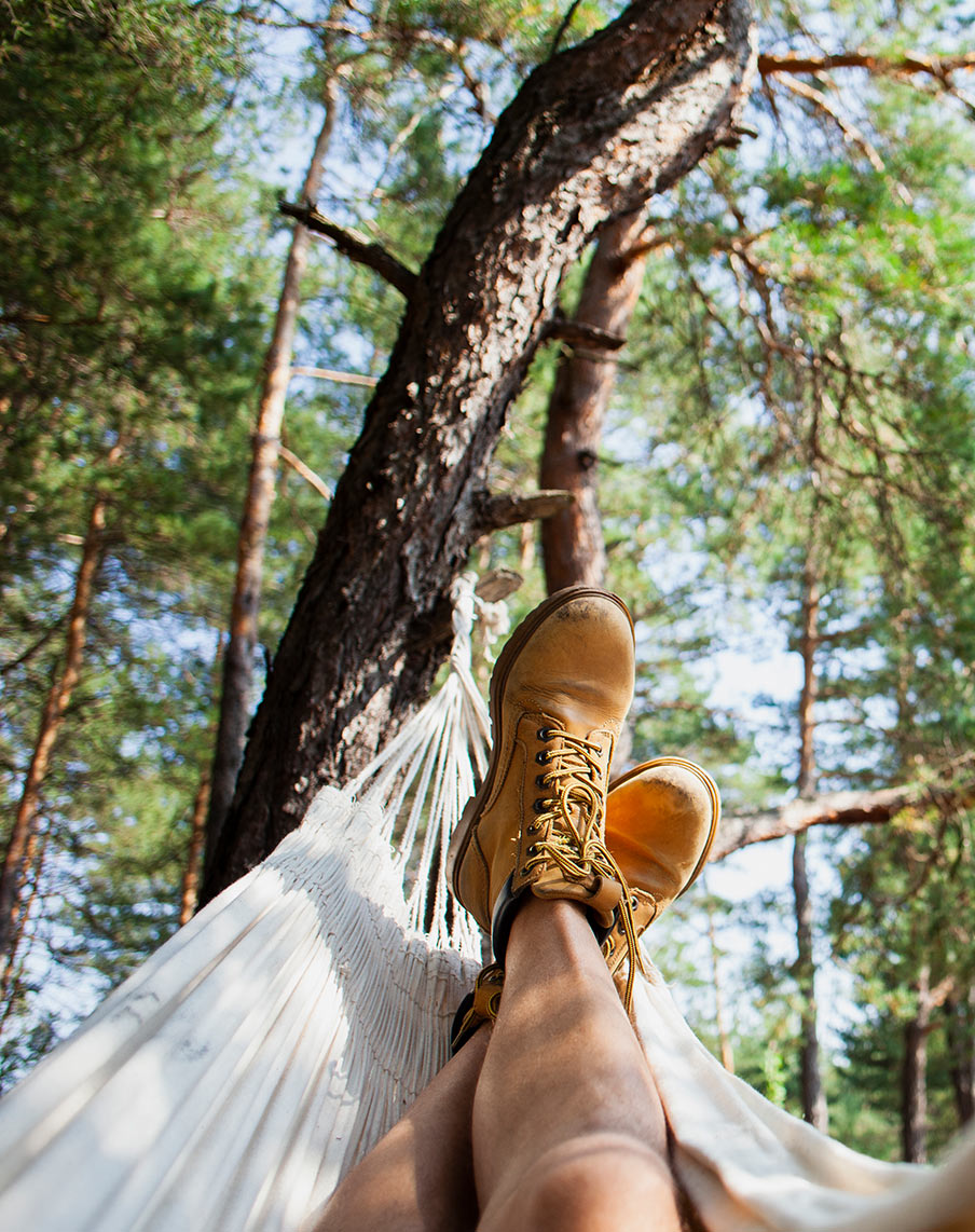 A person relaxing on a hammock