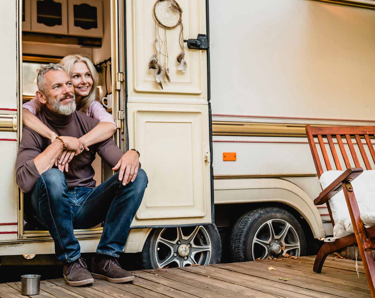 A couple embracing inside of their RV