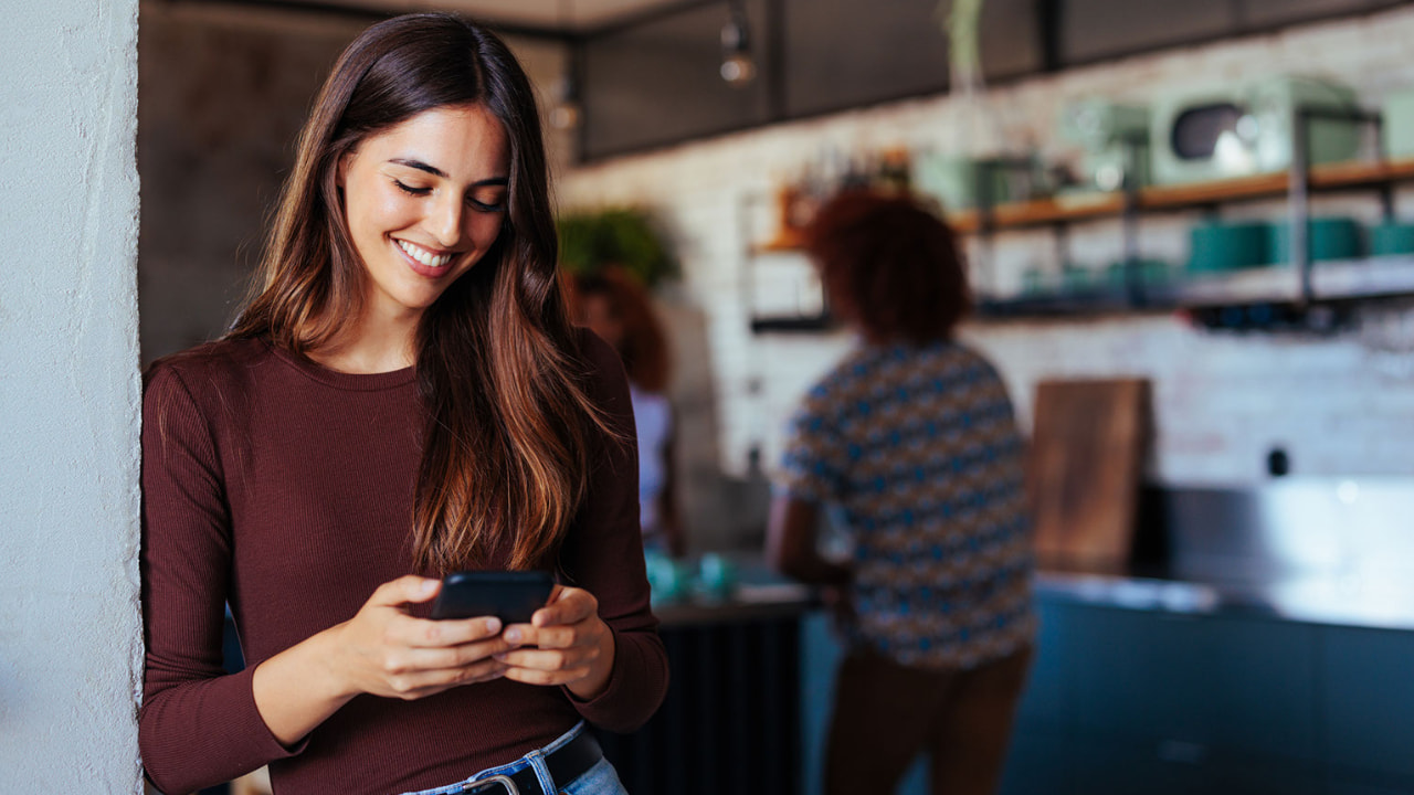 A woman staring at her cellphone