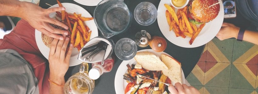 A table filled with plates of food and cups