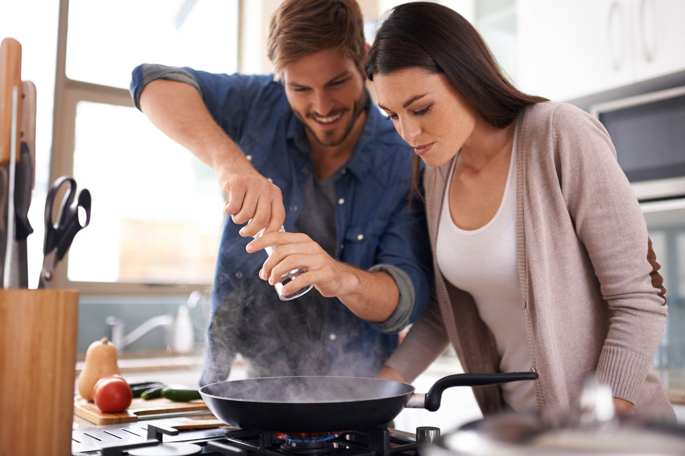 A couple cooking together